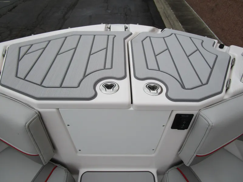 Slide: The Image of 2025 Solara S-250 CW boat deck with gray cushioned seating and storage compartments. - 45