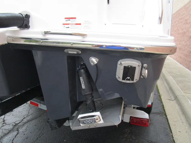 Slide: The Image of Rear view of 2025 Solara S-250 CW boat, showcasing trim tabs and outboard motor mount. - 9