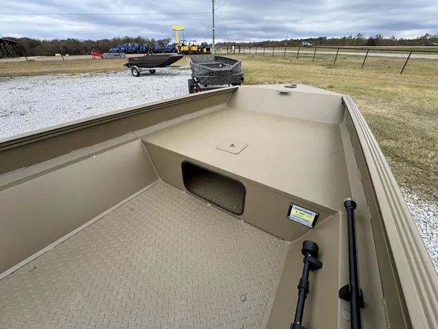 Slide: The Image of 2025 Edge Duck Boats SPORTSMAN 553 DB BO, tan interior, parked on gravel near grassy field. - 8