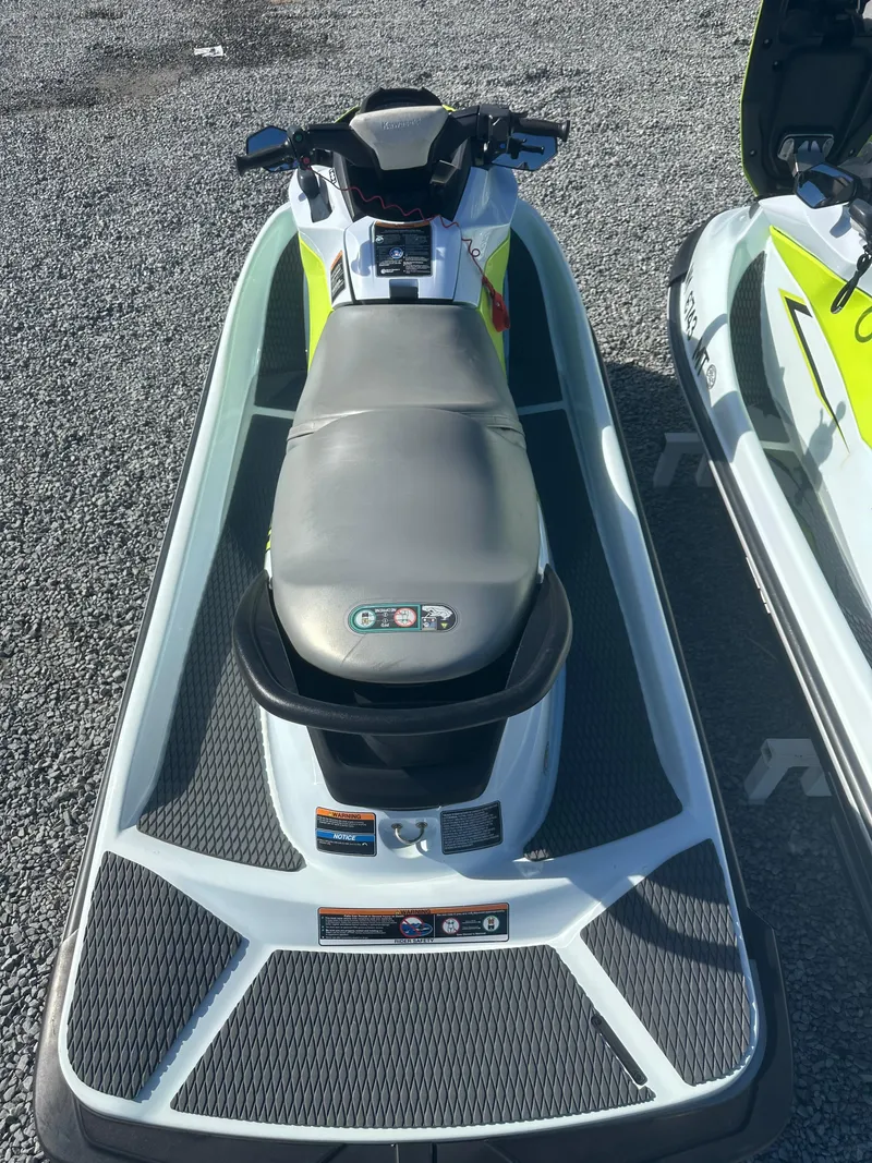 Slide: The Image of 2023 Kawasaki Jetski STX 160 on gravel surface, top view. - 5