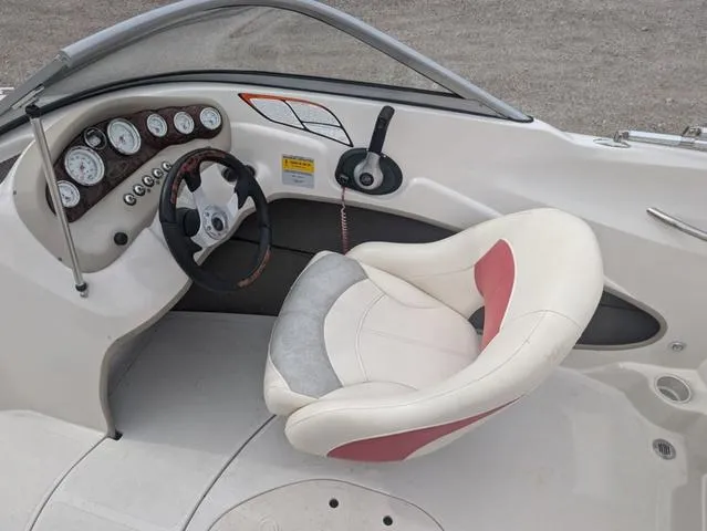 Slide: The Image of 2010 Tahoe Q5i boat cockpit with steering wheel and gauges. - 10
