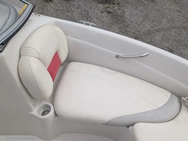 Slide: The Image of 2010 Tahoe Q5i boat interior with white and red seating. - 14