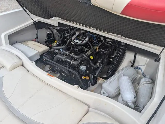 Slide: The Image of 2010 Tahoe Q5i boat engine compartment with open hatch and visible components. - 17