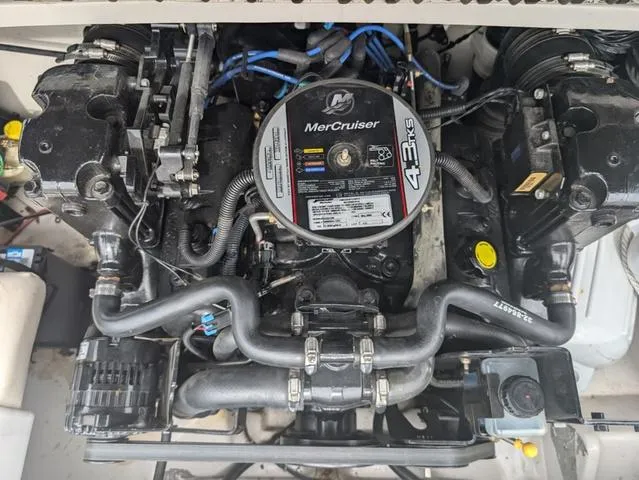 Slide: The Image of 2010 Tahoe Q5i MerCruiser engine, detailed view of components and wiring. - 18