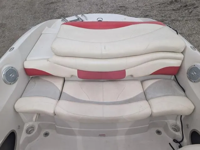 Slide: The Image of 2010 Tahoe Q5i boat interior with white and red cushioned seating. - 19