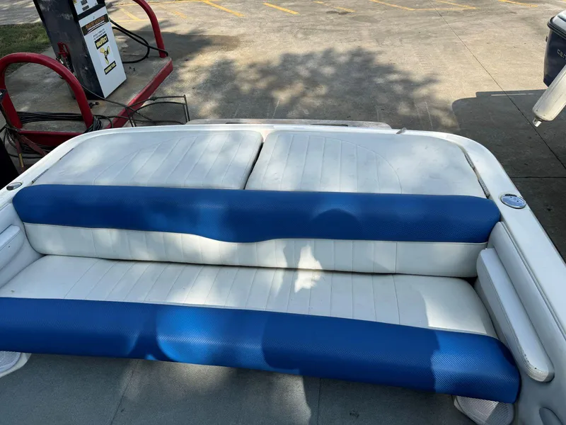 Slide: The Image of 2003 MasterCraft ProStar 197 boat interior with blue and white seating. - 14