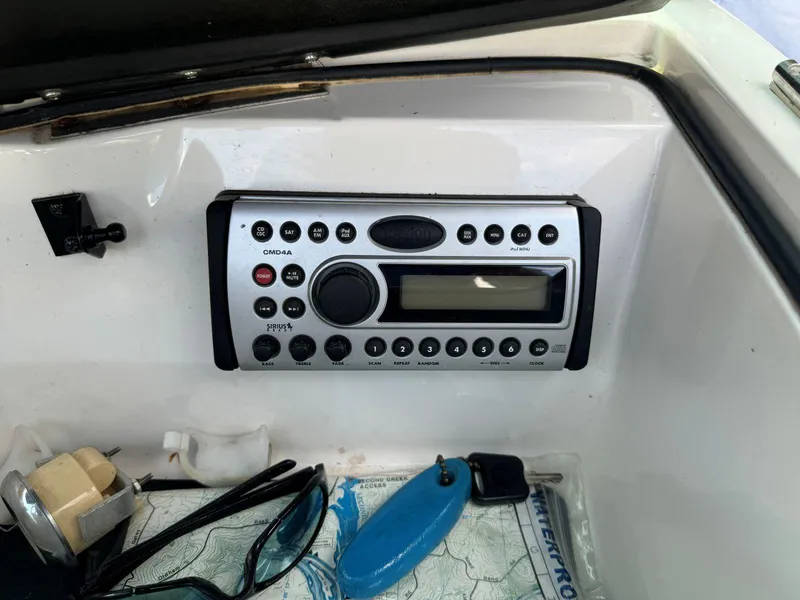 Slide: The Image of 2003 MasterCraft ProStar 197 dashboard with stereo system and accessories. - 19
