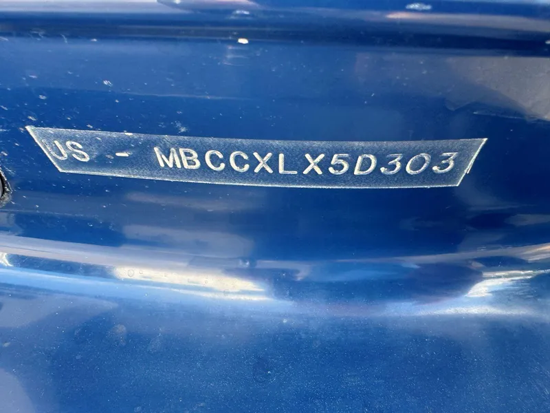 Slide: The Image of 2003 MasterCraft ProStar 197 boat hull identification number on blue surface. - 22