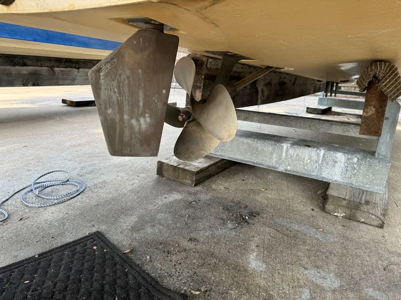 Slide: The Image of 2003 MasterCraft ProStar 197 boat propeller and rudder on a trailer. - 23