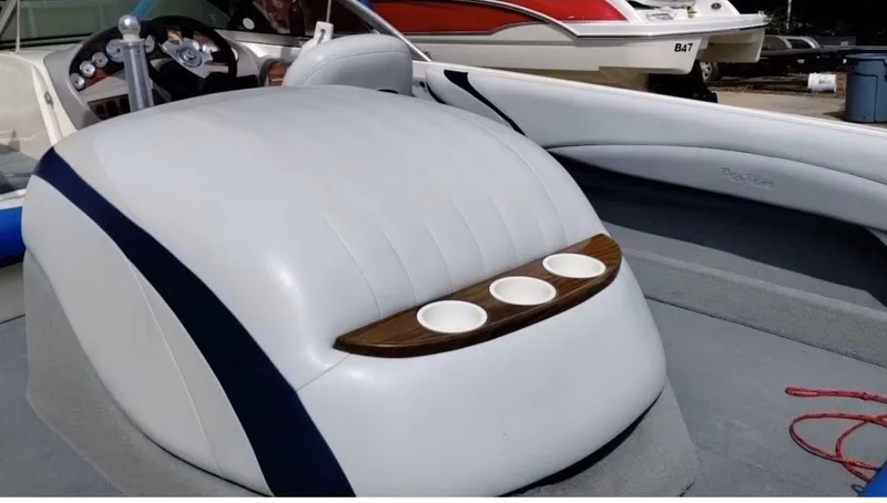Slide: The Image of 2003 MasterCraft ProStar 197 boat interior with cup holders and steering wheel. - 5