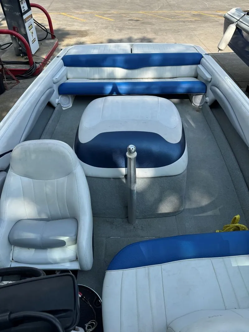 Slide: The Image of 2003 MasterCraft ProStar 197 boat interior with blue and white seating. - 7