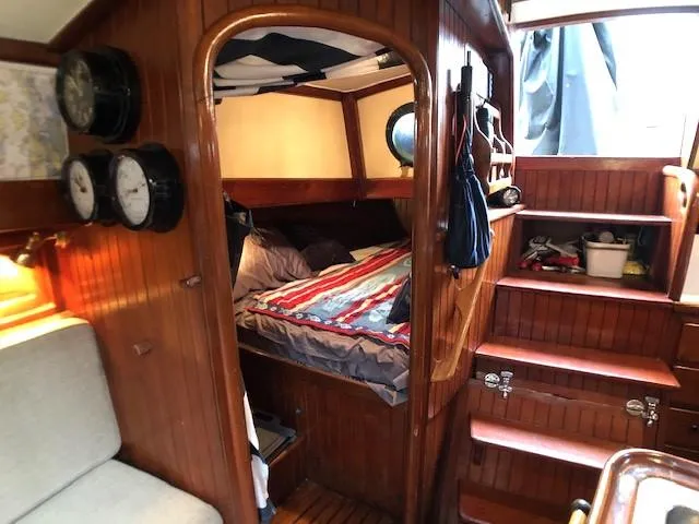 Slide: The Image of Cozy cabin interior of 1979 Hans Christian 38 MKII sailboat with wooden finish and nautical decor. - 23