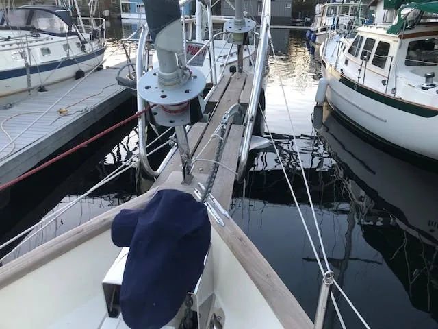 Slide: The Image of 1979 Hans Christian 38 MKII sailboat docked at marina, surrounded by other boats. - 4