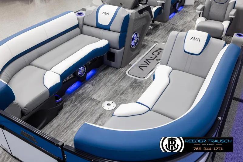 Slide: The Image of 2025 Avalon Catalina QLS boat interior with blue and gray seating, modern design. - 10