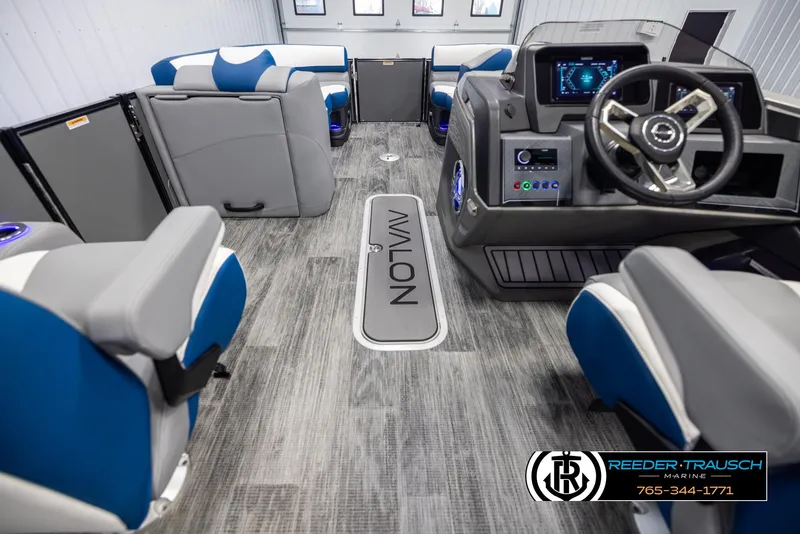 Slide: The Image of Interior of 2025 Avalon Catalina QLS boat with modern seating and steering console. - 17