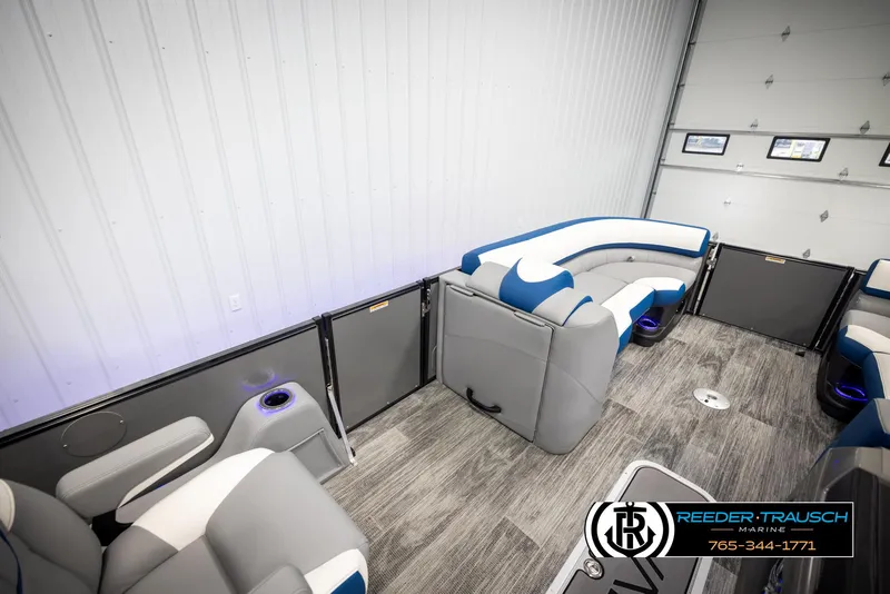 Slide: The Image of 2025 Avalon Catalina QLS interior with modern seating and sleek design in a showroom. - 21