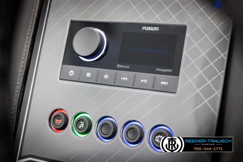 Slide: The Image of 2025 Avalon Catalina QLS control panel with Fusion audio system and illuminated buttons. - 29