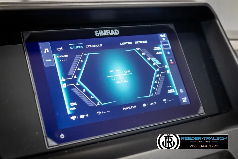 Slide: The Image of Simrad display on 2025 Avalon Catalina QLS boat dashboard, showing gauges and controls. - 30