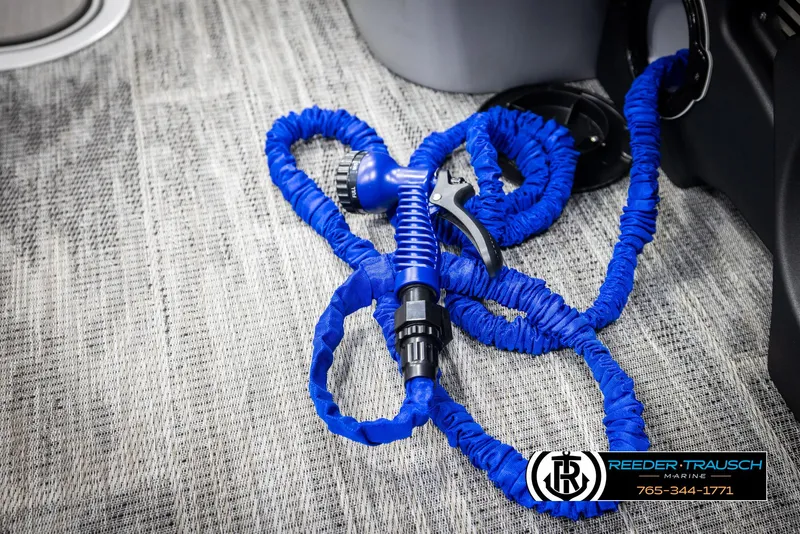 Slide: The Image of Blue coiled hose on Avalon Catalina QLS 2025 boat floor. - 37