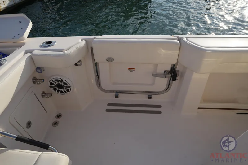 Slide: The Image of 2024 Grady-White Canyon 336 boat interior, featuring a sleek deck and water view. - 25