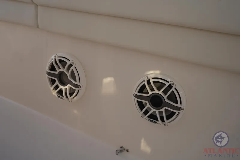Slide: The Image of 2024 Grady-White Canyon 336 boat speakers, white interior, Atlantic Marine logo. - 33