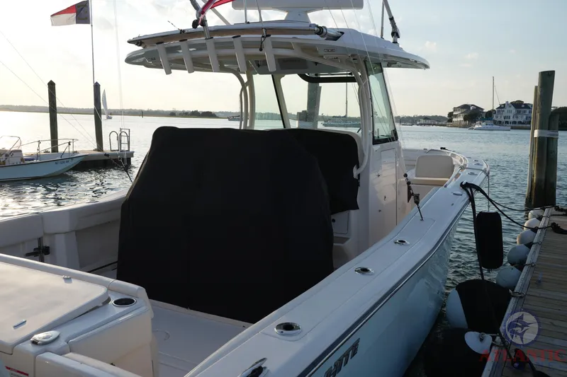 Slide: The Image of 2024 Grady-White Canyon 336 boat docked at marina, side view. - 42