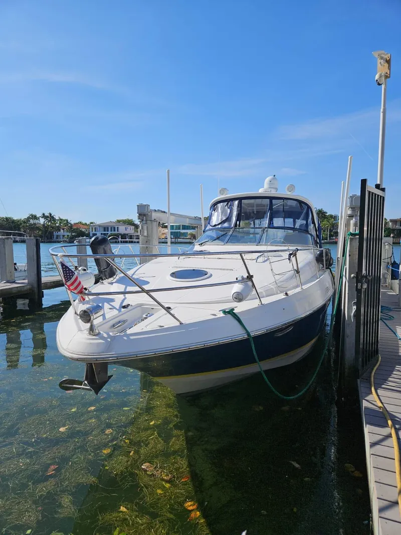 Slide: The Image of 2007 Regal 3760 Sportyacht docked in clear water under a blue sky. - 15