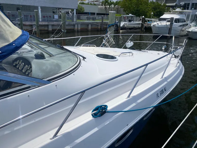 Slide: The Image of 2007 Regal 3760 Sportyacht docked in marina, sleek white design. - 17