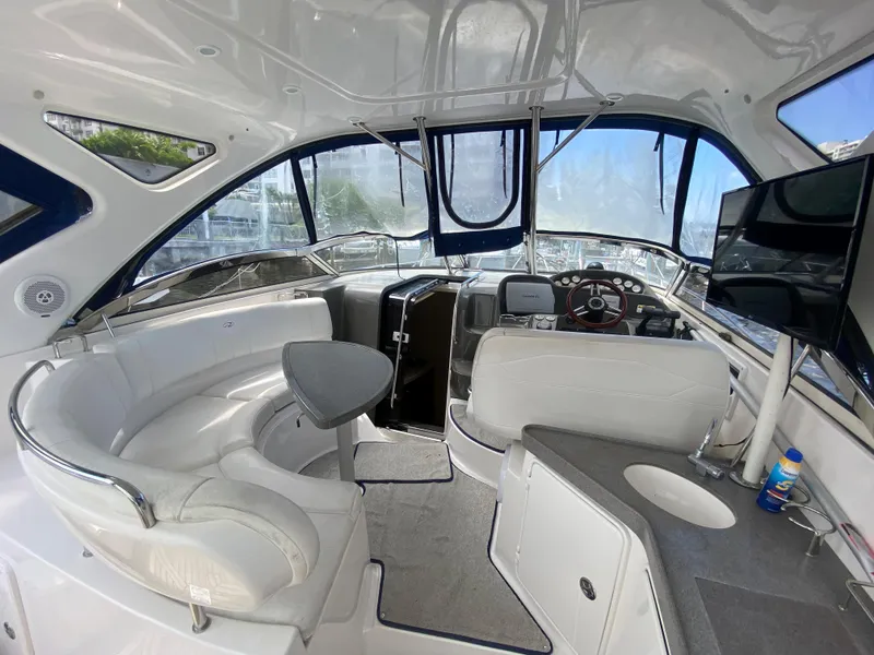Slide: The Image of Interior of 2007 Regal 3760 Sportyacht with white seating and modern amenities. - 20