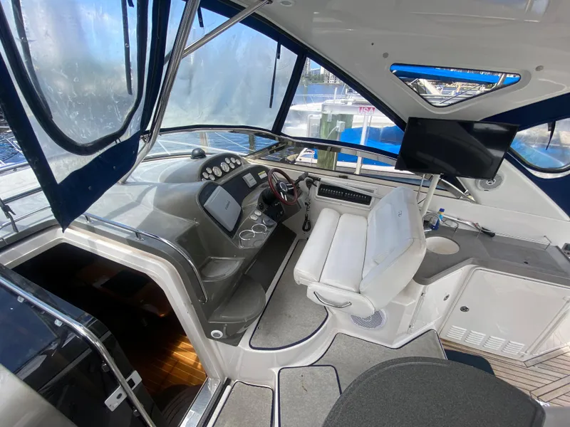 Slide: The Image of 2007 Regal 3760 Sportyacht cockpit with modern controls and seating. - 21