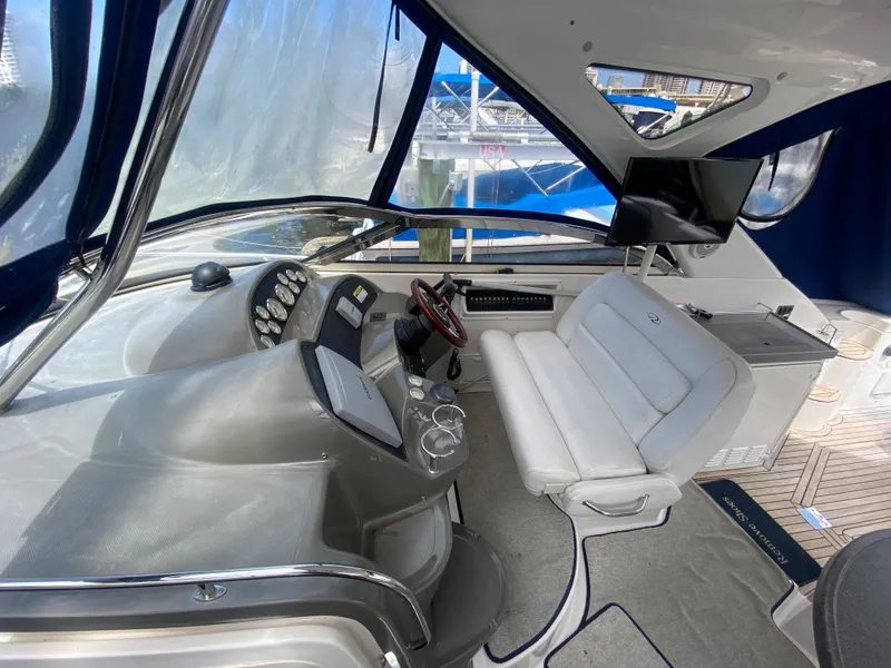 Slide: The Image of Interior of 2007 Regal 3760 Sportyacht cockpit with steering wheel and seating. - 23