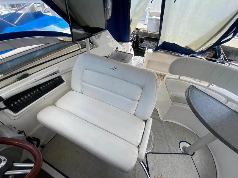 Slide: The Image of 2007 Regal 3760 Sportyacht interior with white seating and table. - 25