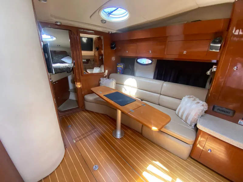 Slide: The Image of Luxurious 2007 Regal 3760 Sportyacht interior with wood finish and comfortable seating. - 31