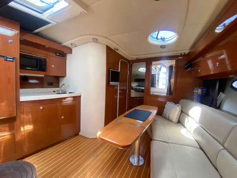 Slide: The Image of Interior of 2007 Regal 3760 Sportyacht with wood finishes and modern amenities. - 36