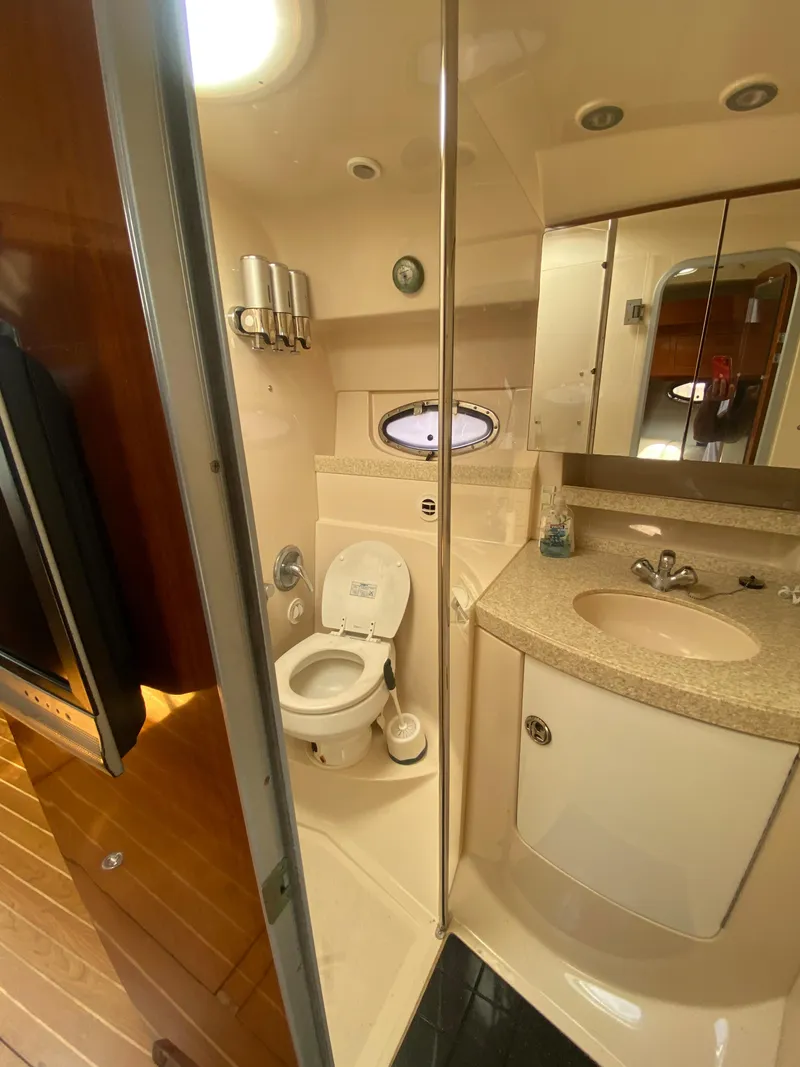 Slide: The Image of 2007 Regal 3760 Sportyacht bathroom with toilet, sink, and mirror. - 37