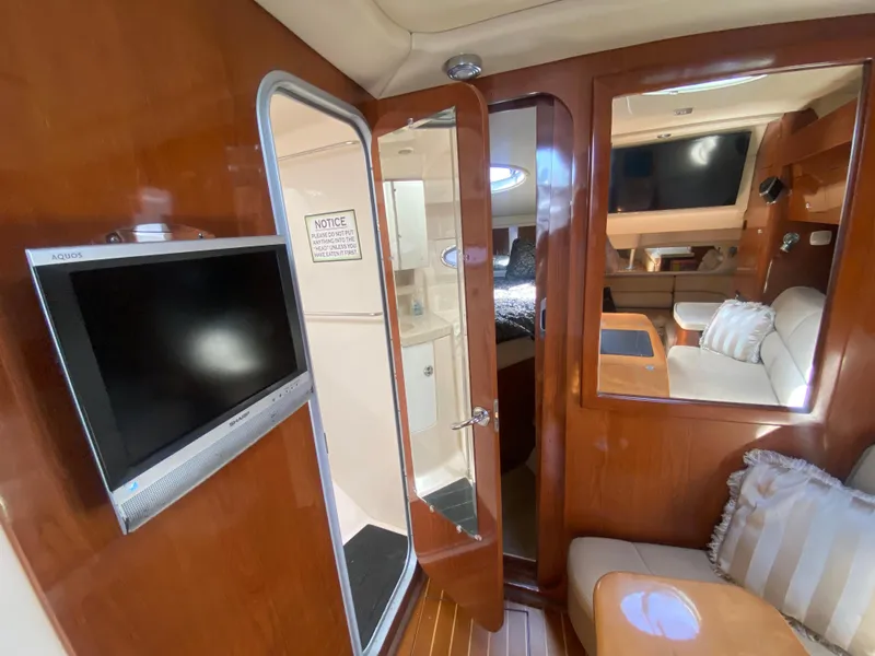 Slide: The Image of Luxurious interior of 2007 Regal 3760 Sportyacht with wood finishes and modern amenities. - 38