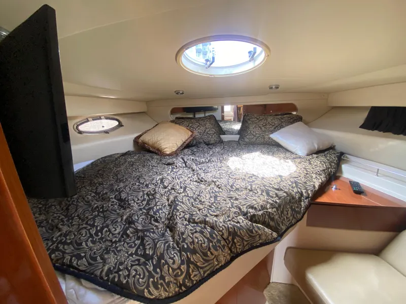 Slide: The Image of Luxurious 2007 Regal 3760 Sportyacht cabin with elegant bedding and natural light. - 39