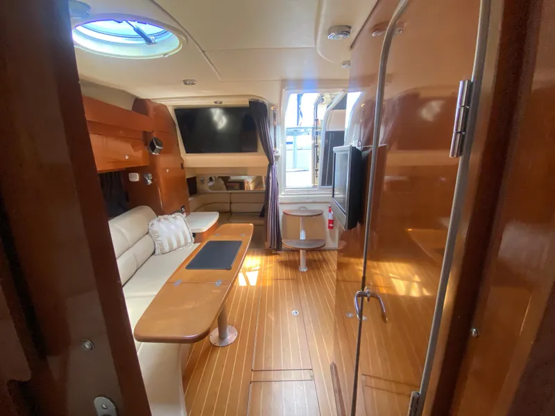 Slide: The Image of Interior of 2007 Regal 3760 Sportyacht with wood flooring and seating area. - 40