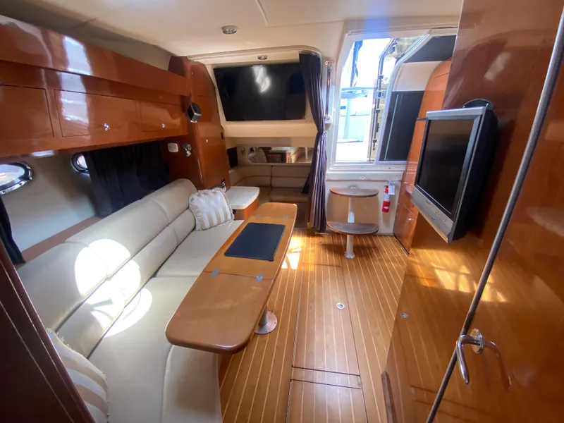 Slide: The Image of Luxurious interior of 2007 Regal 3760 Sportyacht with wood finish and plush seating. - 41