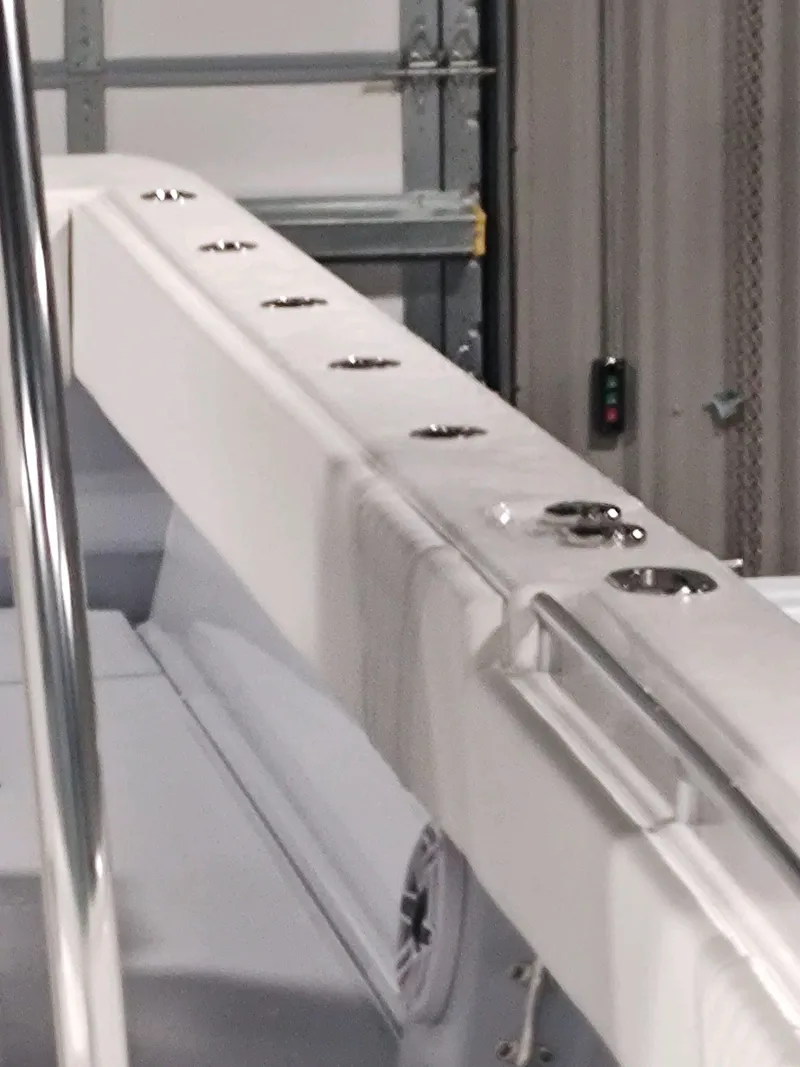 Slide: The Image of 2024 Contender 39 ST boat detail with sleek white design and metal fixtures. - 14