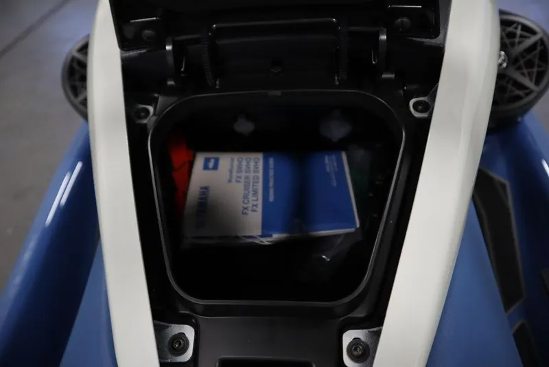 Slide: The Image of Open storage compartment of 2025 Yamaha WaveRunner FX Limited SVHO, showing manual inside. - 21