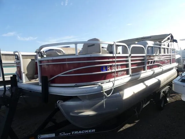 Slide: The Image of 2020 Sun Tracker FISHIN' BARGE® 20 DLX pontoon boat on trailer, side view. - 3