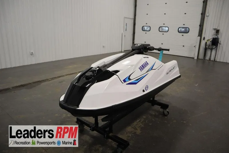 The Image of 2025 Yamaha WaveRunner SuperJet in showroom, white with blue accents, displayed on a stand. - 0