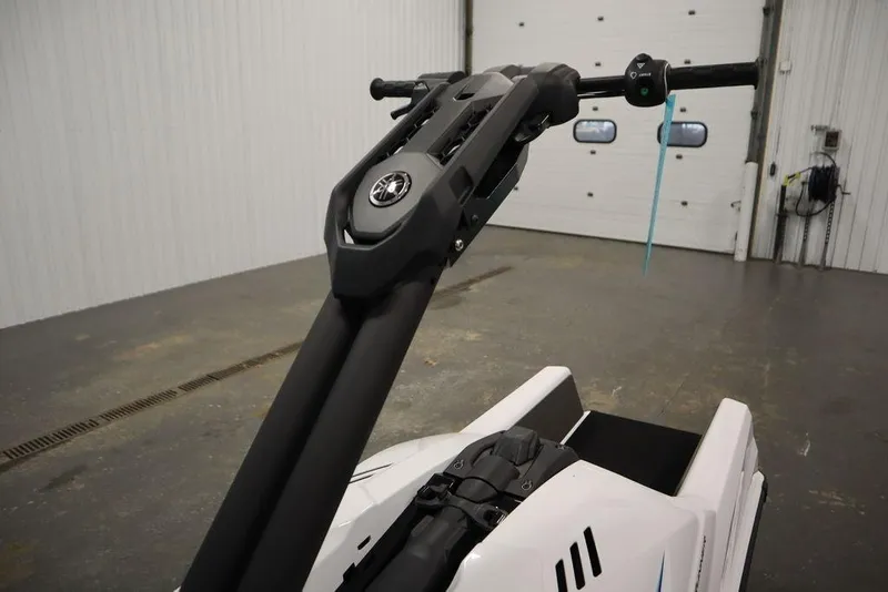 Slide: The Image of 2025 Yamaha WaveRunner SuperJet handlebar in a garage setting. - 10