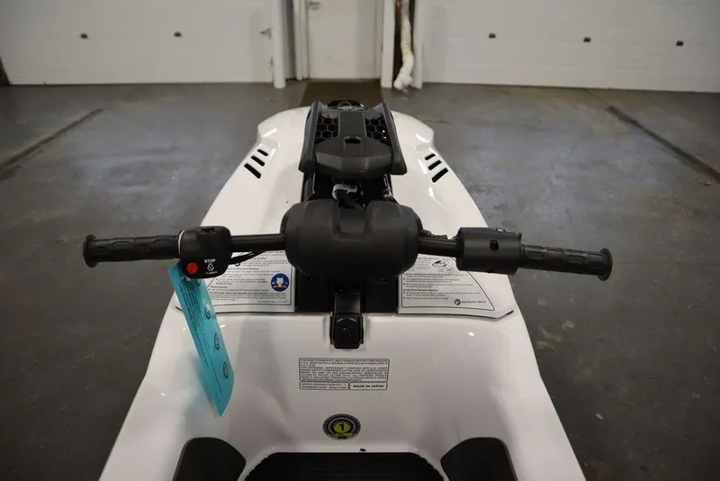 Slide: The Image of 2025 Yamaha WaveRunner SuperJet handlebars in a garage setting. - 11