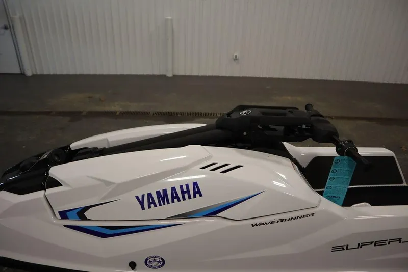 Slide: The Image of 2025 Yamaha WaveRunner SuperJet in a showroom, showcasing sleek design and branding. - 12