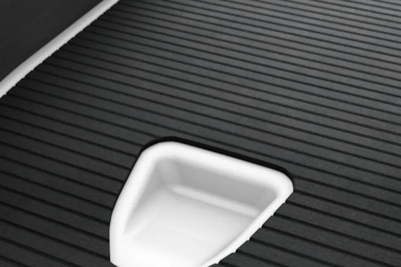 Slide: The Image of 2025 Yamaha WaveRunner SuperJet textured deck detail, featuring sleek black grooves. - 22