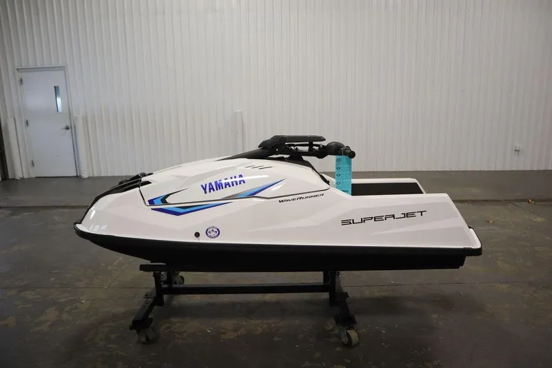 Slide: The Image of 2025 Yamaha WaveRunner SuperJet in a showroom, side view. - 9
