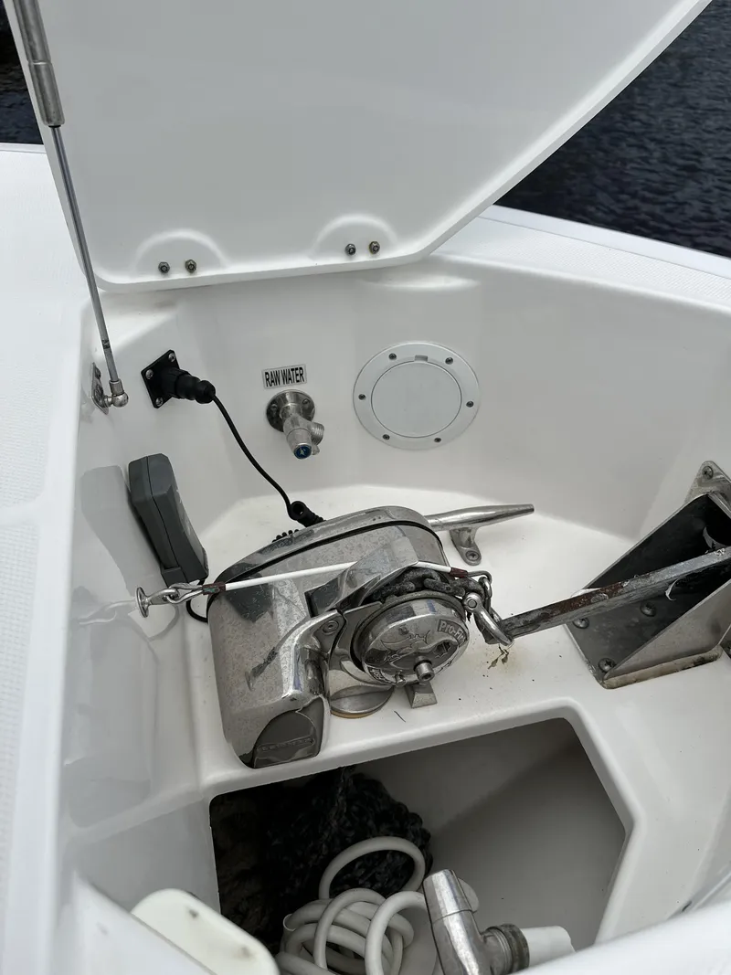 Slide: The Image of 2017 Everglades 435 Center Console anchor compartment with winch and storage. - 25