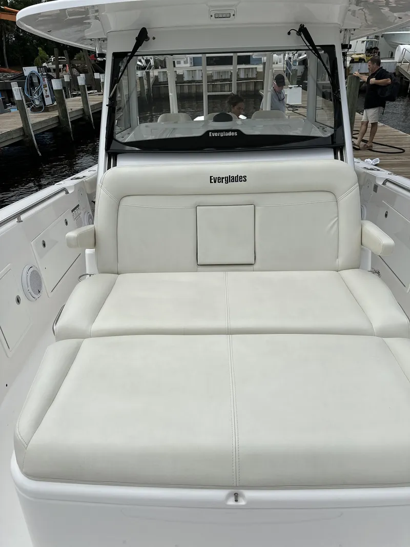 Slide: The Image of 2017 Everglades 435 Center Console boat with white seating and spacious deck. - 27